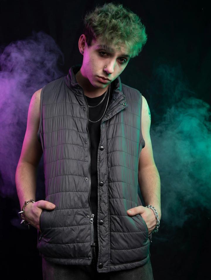 Mellow777, grey vest and green hair, purple and green smoke