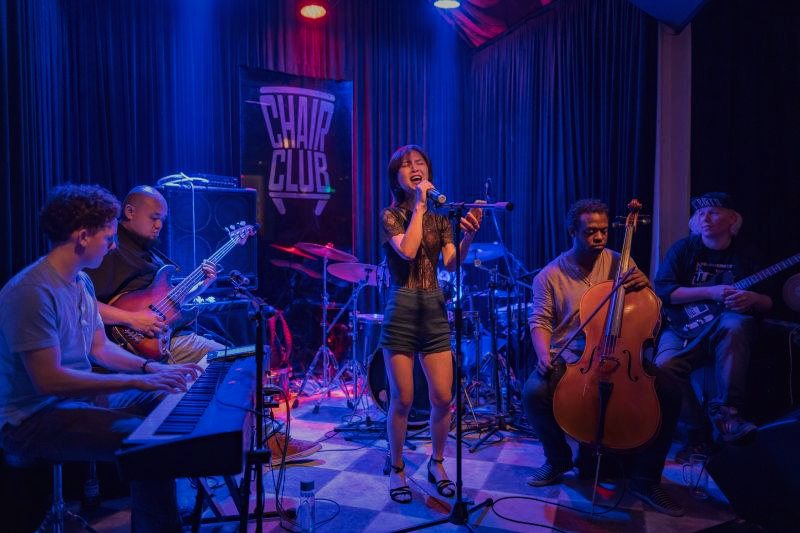 RAHAM on keyboards with his band on a club stage